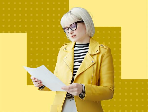 A woman examining a paper.