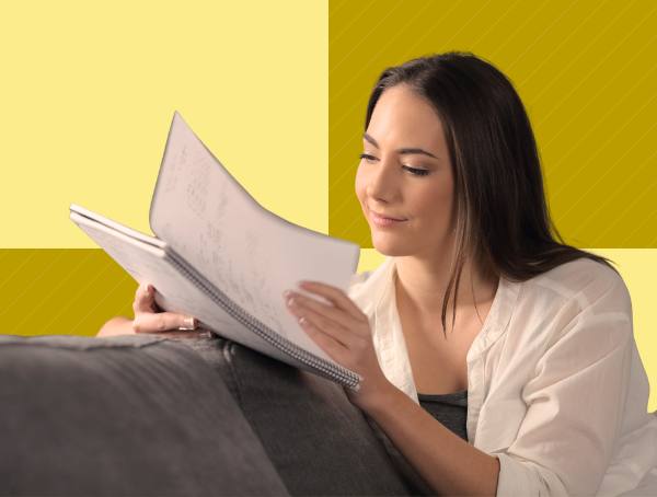 A woman reviews a paper