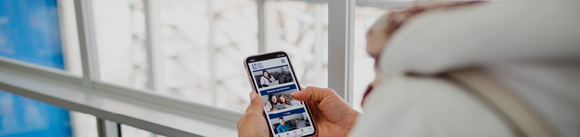 A person scrolls RPL resources for adults on their mobile phone.